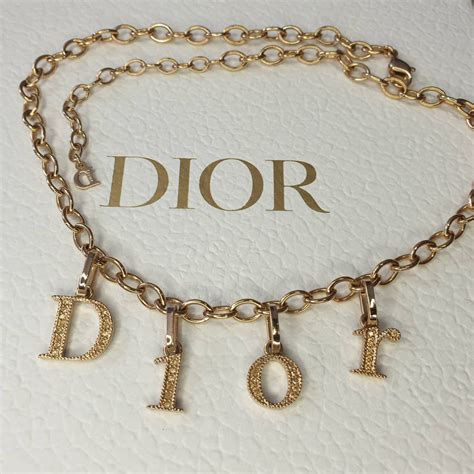 christian dior necklace gold|dior letters necklace value.